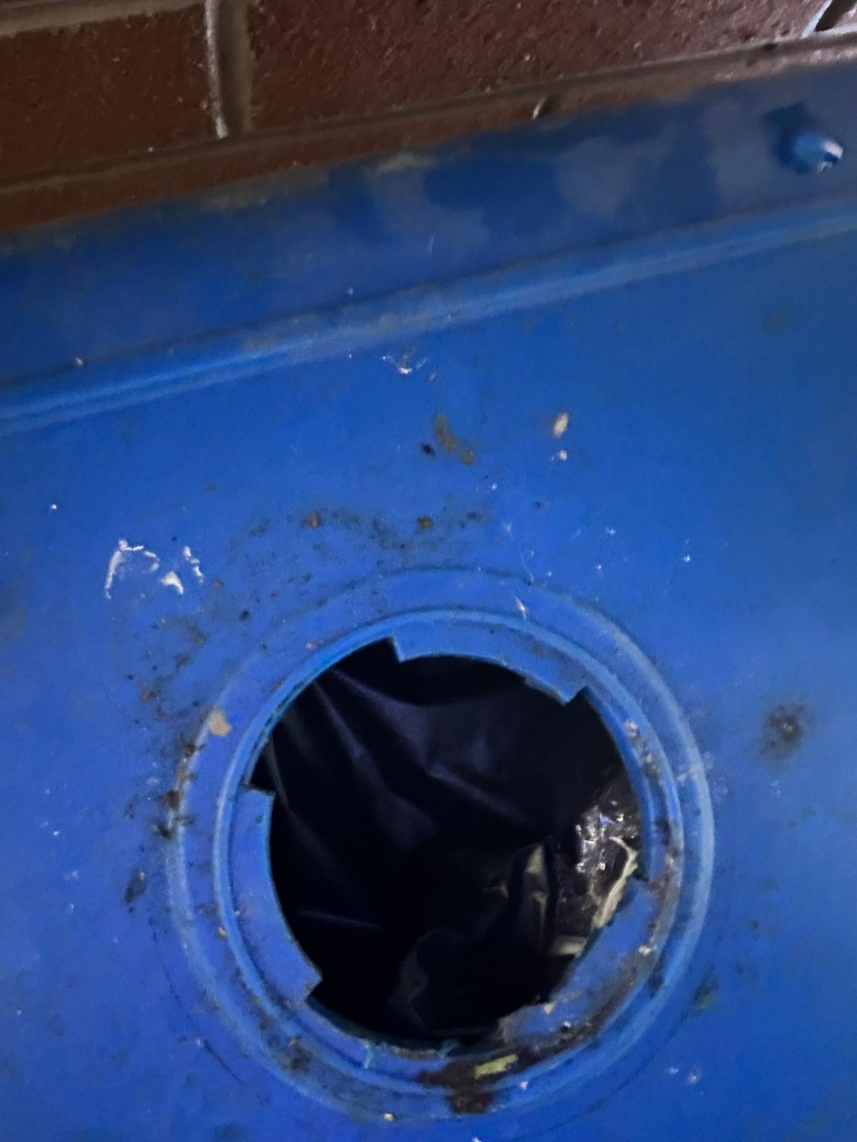 Commercial wheelie bin with missing drain bung allowing rat access at a takeaway in Wallsend (NE28).